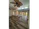 Open living room featuring wood floors, ceiling fans, and lots of light at 2055 Sunset Point Rd # 3804, Clearwater, FL 33765