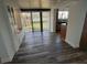 Inviting living room with wood floors, lots of natural light and built-in storage and seating at 2055 Sunset Point Rd # 3804, Clearwater, FL 33765