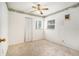 This bedroom is carpeted, features a ceiling fan, and is illuminated by natural light through a window at 20653 Old Trilby Rd, Dade City, FL 33523