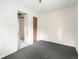 This bedroom features carpet flooring and natural lighting at 20653 Old Trilby Rd, Dade City, FL 33523