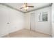 Cozy bedroom features ceiling fan, carpet, and a window for natural light at 20653 Old Trilby Rd, Dade City, FL 33523