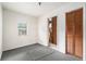 This bedroom features carpet flooring and natural lighting at 20653 Old Trilby Rd, Dade City, FL 33523