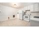A kitchen featuring tile flooring, all-white appliances, and wooden cabinets at 20653 Old Trilby Rd, Dade City, FL 33523