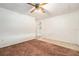 The living room features tile and carpet flooring with a ceiling fan at 20653 Old Trilby Rd, Dade City, FL 33523