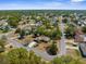 Aerial view of a home in a quiet residential neighborhood with tree-lined streets at 2072 Maguire Ave, Spring Hill, FL 34608