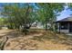 The backyard shows mature trees and grass at 2072 Maguire Ave, Spring Hill, FL 34608