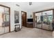 Bedroom with mirrored closet and slider doors to the sunroom at 2072 Maguire Ave, Spring Hill, FL 34608