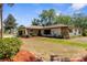 Charming single-story home with well-manicured front yard and appealing landscaping at 2072 Maguire Ave, Spring Hill, FL 34608
