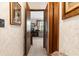 Hallway looking through to the living room with natural lighting at 2072 Maguire Ave, Spring Hill, FL 34608