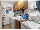 Laundry room with washer, dryer, sink and cabinets at 2072 Maguire Ave, Spring Hill, FL 34608