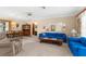 Open-concept living area with dining space, showcasing comfortable seating and ample natural light at 2072 Maguire Ave, Spring Hill, FL 34608