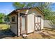 Outbuilding featuring double doors and a window at 2072 Maguire Ave, Spring Hill, FL 34608
