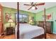 Bright bedroom with green walls, hard wood floors, and natural lighting at 220 22Nd Se Ave, St Petersburg, FL 33705