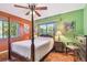 Bright bedroom featuring windows, ceiling fan, and hardwood floors at 220 22Nd Se Ave, St Petersburg, FL 33705