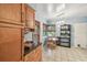 Eat in kitchen with tile flooring, wood cabinetry, and natural lighting at 220 22Nd Se Ave, St Petersburg, FL 33705