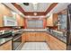 Well-lit kitchen with stainless appliances, ample counter space, and warm-toned cabinets at 220 22Nd Se Ave, St Petersburg, FL 33705