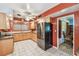 Open kitchen with stainless steel appliances, wood cabinets, and breakfast nook at 220 22Nd Se Ave, St Petersburg, FL 33705