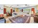 Spacious living room with a large sectional sofa, windows, and decorative rug at 220 22Nd Se Ave, St Petersburg, FL 33705
