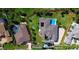 Aerial shot of property, highlighting backyard pool and landscaping. Property boundary lines are red at 2605 59Th S St, Gulfport, FL 33707