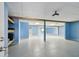 Open basement space with bright blue walls, drop ceiling, and ample lighting at 2605 59Th S St, Gulfport, FL 33707