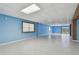 Basement area featuring blue walls, bright lighting, and multiple windows at 2605 59Th S St, Gulfport, FL 33707