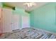 Bright bedroom featuring laminate floors, two closets, and a ceiling fan at 2605 59Th S St, Gulfport, FL 33707