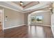 Spacious bedroom featuring hardwood floors, tray ceiling, large windows with natural light, and designer touches at 2605 59Th S St, Gulfport, FL 33707
