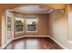 Bright room with hardwood floors and large windows overlooking the pool and landscaped backyard at 2605 59Th S St, Gulfport, FL 33707