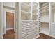 Spacious walk-in closet with custom shelves and drawers at 2605 59Th S St, Gulfport, FL 33707