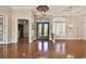 Spacious foyer with soaring ceilings, elegant chandelier, and exquisite iron-wrought entry door at 2605 59Th S St, Gulfport, FL 33707