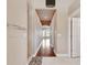 Long hallway with tiled floors and hardwood floors leading to a bathroom with a shower and a living area at 2605 59Th S St, Gulfport, FL 33707