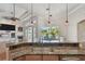 Updated kitchen island with stainless sink and backyard view, plus updated backsplash at 2605 59Th S St, Gulfport, FL 33707