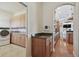 A laundry room area with tan cabinets at 2605 59Th S St, Gulfport, FL 33707