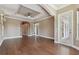 Bright living room featuring hardwood floors, white trim, and an elegant tray ceiling at 2605 59Th S St, Gulfport, FL 33707