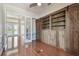 Bright office space with hardwood floors, custom shelving, and barn door accents at 2605 59Th S St, Gulfport, FL 33707