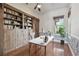 Charming home office with hardwood floors, custom wood shelving, and a window at 2605 59Th S St, Gulfport, FL 33707