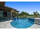 Backyard pool with lush landscaping and scenic golf course views at 2605 59Th S St, Gulfport, FL 33707