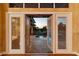 Open glass doors showcasing the pool and backyard at sunset at 2605 59Th S St, Gulfport, FL 33707