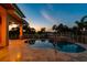 Outdoor pool featuring a spa, stone deck, lush landscaping, and stunning sunset views at 2605 59Th S St, Gulfport, FL 33707