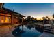 Stunning backyard pool with spa, patio, and views of the golf course at dusk at 2605 59Th S St, Gulfport, FL 33707