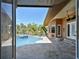 Backyard pool view from the covered patio, framed by large glass doors, offering a serene outdoor living space at 2605 59Th S St, Gulfport, FL 33707