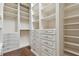 Spacious walk-in closet with custom shelving and drawer units for optimal storage at 2605 59Th S St, Gulfport, FL 33707
