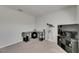 Simple bedroom featuring carpeted floors, a desk, and media storage with neutral colored walls at 2805 Gumbo Limbo Dr, Wimauma, FL 33598