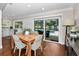 A lovely dining area offering views of the pool and outdoor entertaining area at 2950 Meadow Hill Dr, Clearwater, FL 33761