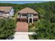 Aerial shot of the property showcasing the home's location surrounded by lush greenery and other homes at 3100 Barbour Trl, Odessa, FL 33556