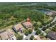 Stunning aerial view of estate home near lake, with lush landscaping and beautiful architectural details at 3100 Barbour Trl, Odessa, FL 33556