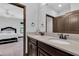 Bathroom features double sinks, granite countertops and a decorative mirror at 3100 Barbour Trl, Odessa, FL 33556