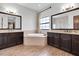 Elegant bathroom with tub, dual sinks, and spacious layout at 3100 Barbour Trl, Odessa, FL 33556