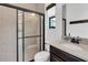 This modern bathroom features a glass shower and a sleek vanity at 3100 Barbour Trl, Odessa, FL 33556