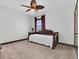 Bedroom featuring ceiling fan, natural light, daybed and neutral carpet at 3100 Barbour Trl, Odessa, FL 33556